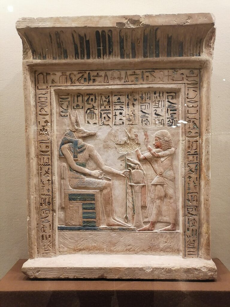 Anubis receiving offerings, hieroglyph name